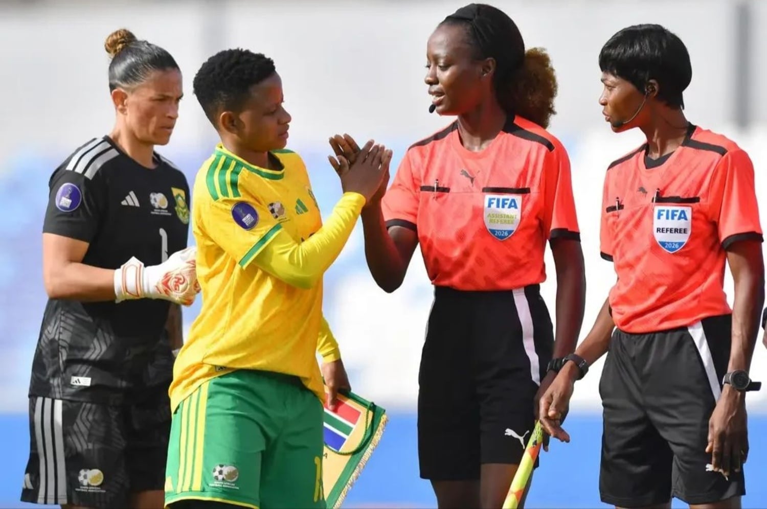 Banyana Banyana captain Refiloe Jane and Kaylin Swart greetings match officials