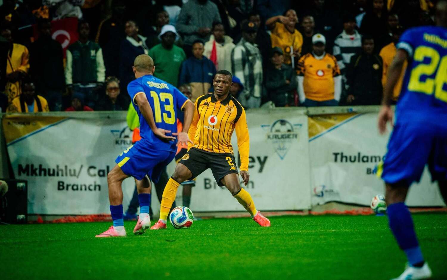Ebrahim Seedat of Kruger United tries to mark Kaizer Chiefs defender Thabiso Monyane in a Betway Premiership tie