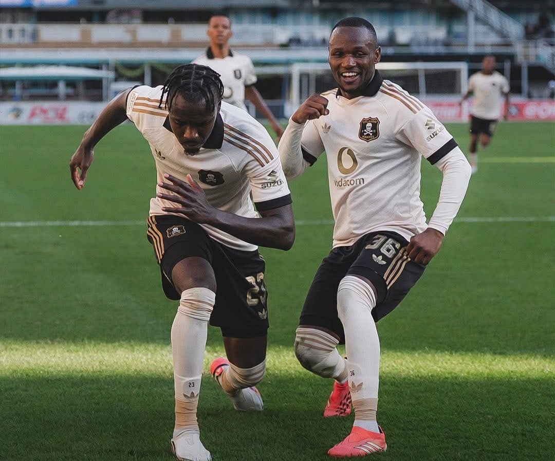 Ghampani Lungu and Kamogelo Sebelebele celebrating a goal for Orlando Pirates