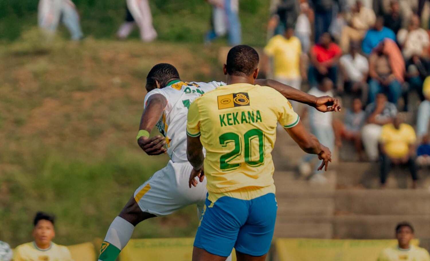 Grant Kekana of Mamelodi Sundowns in an areal challenge with Golden Arrows striker Junior Dion
