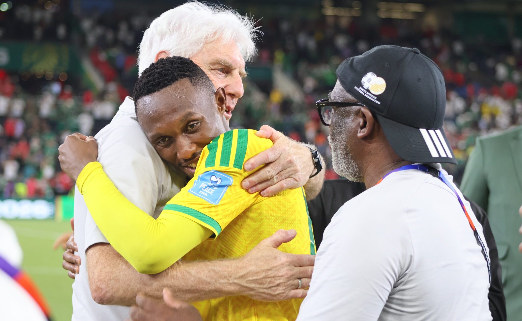 Hugo Broos and Thapelo Maseko sharing a moment at the 2026 FIFA World Cup