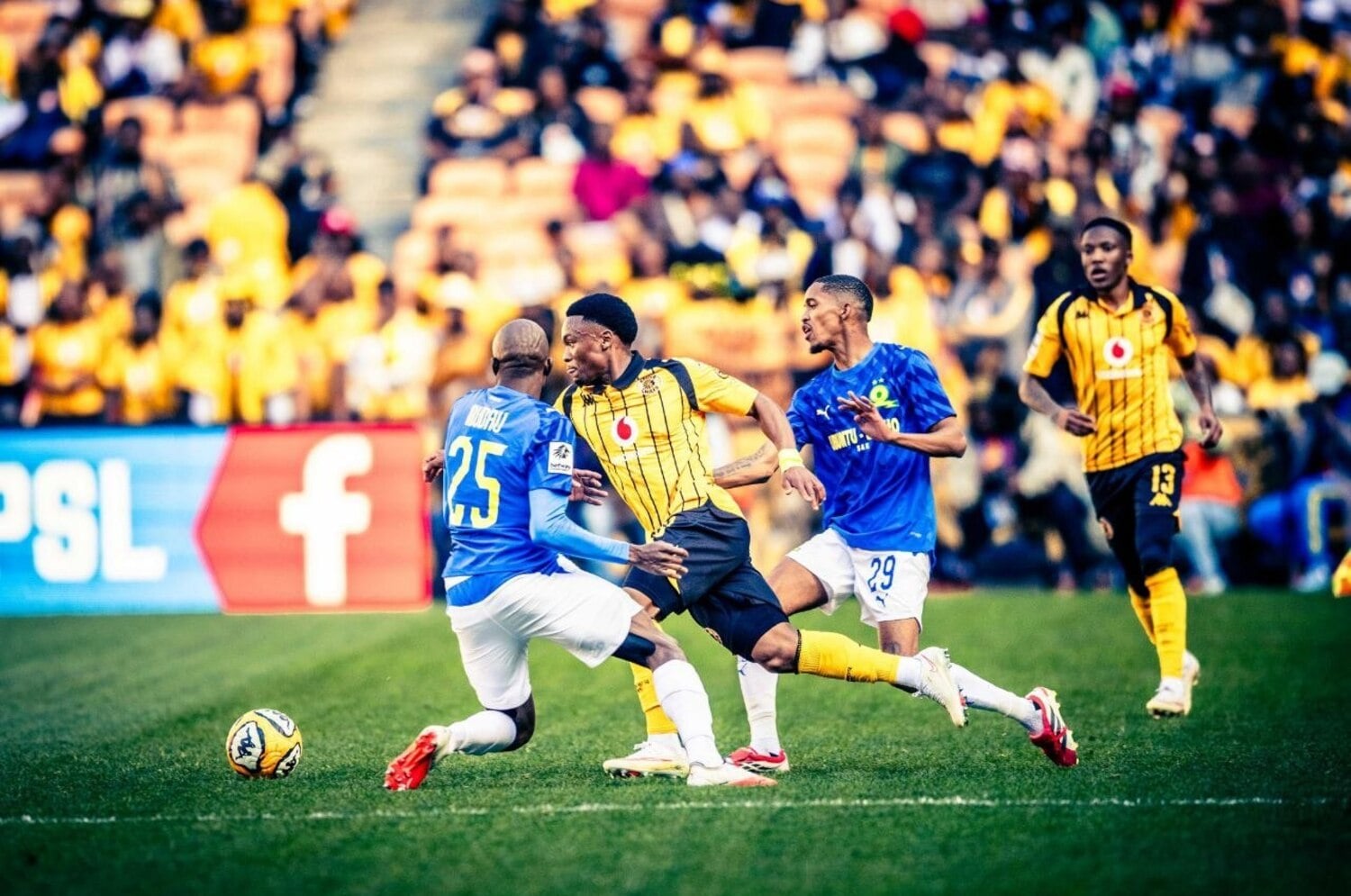 Kaizer Chiefs winger Langelihle Phiri dribbles past Mamelodi Sundowns' Khuliso Mudau and Antonio van Wyk