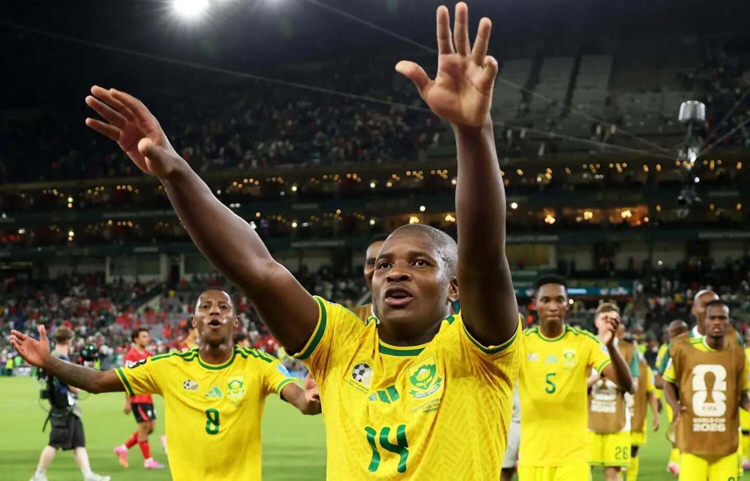 Mbekezeli Mbokazi leading Bafana Bafana players in celebrating beating South Korea at the 2026 FIFA World Cup