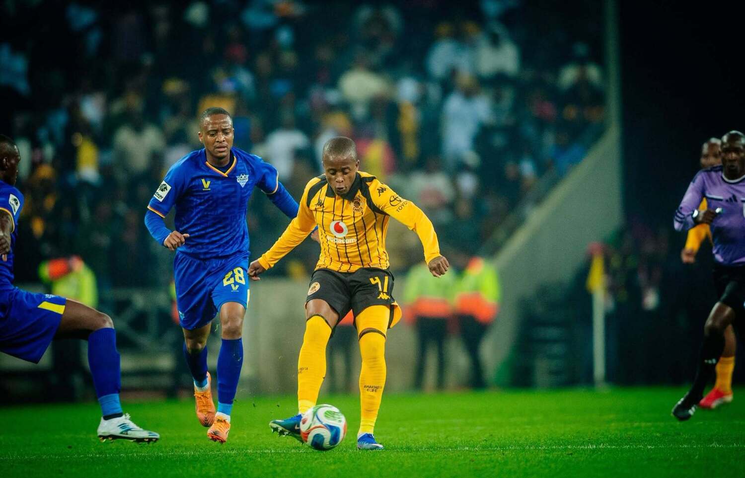 Nkosinathi Thwala of Kruger United marking Kaizer Chiefs forward Wandile Duba