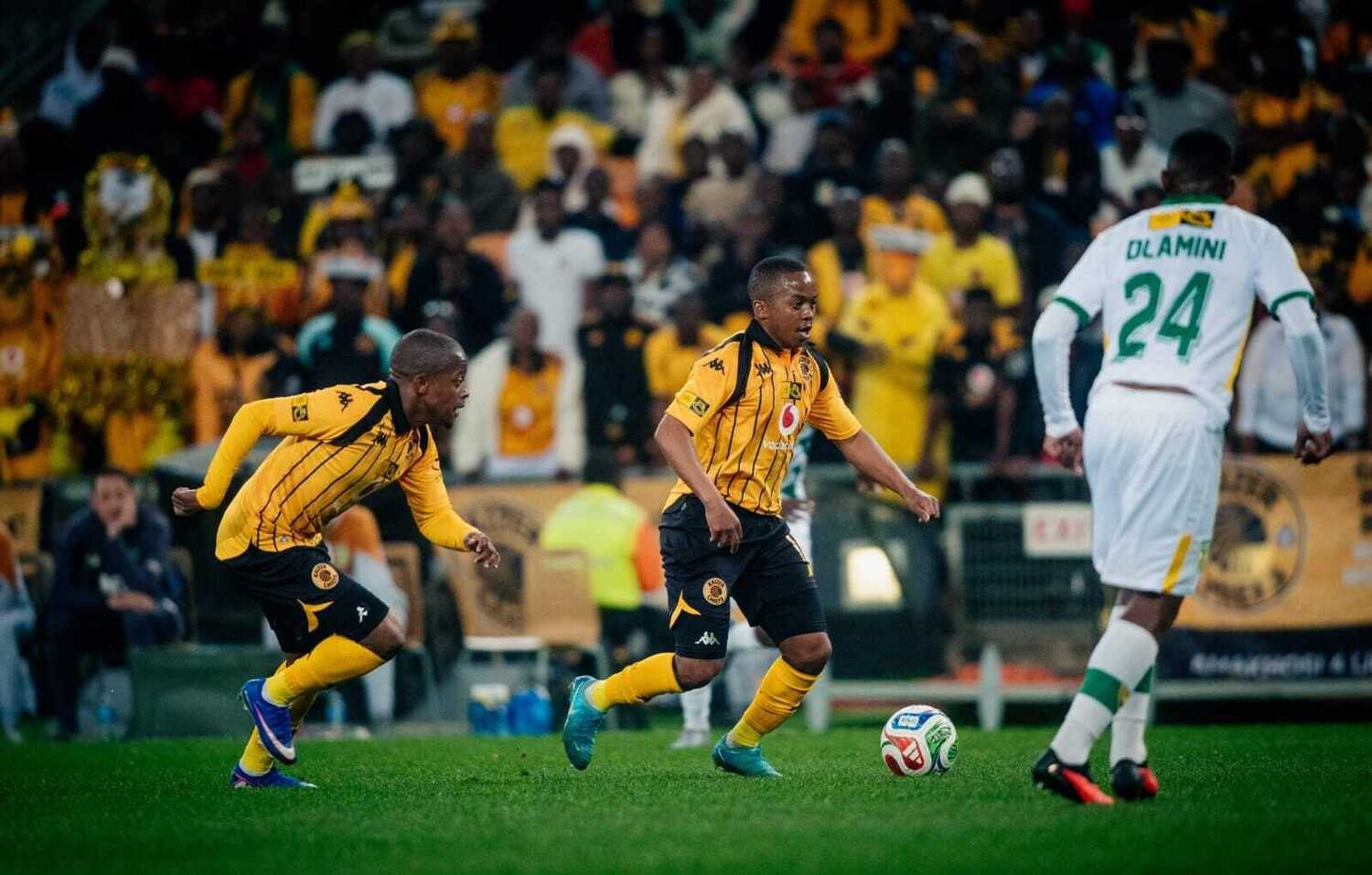 Kaizer Chiefs midfielder Nkosingiphile Ngcobo dribbles the ball past a Golden Arrows player