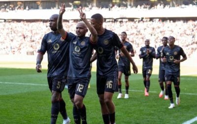 Oswin Appollis celebrates with Orlando Pirates teammates Nkosinathi Sibisi and Cemran Dansin