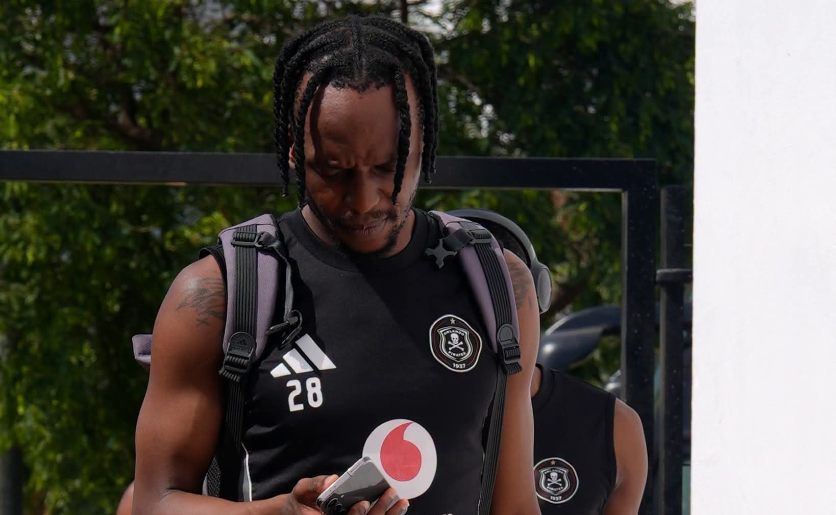Patrick Maswanganyi looking at his phone during a camp in Spain with Orlando Pirates.