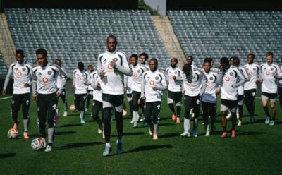 Orlando Pirates players running during a training session in Orlando Stadium.