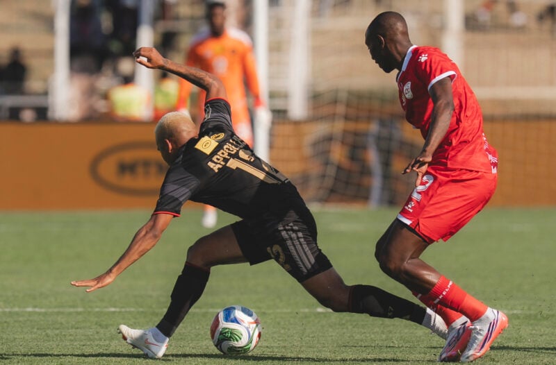 Orlando Pirates winger Oswin Appollis tries to wheel away from Sekhukhune United defender Nyiko Mobbie during an MTN8 tie