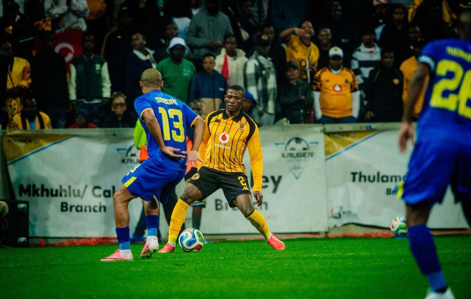 Kaizer Chiefs defender Thabiso Monyane tries to get past Kruger United's Ebrahim Seedat