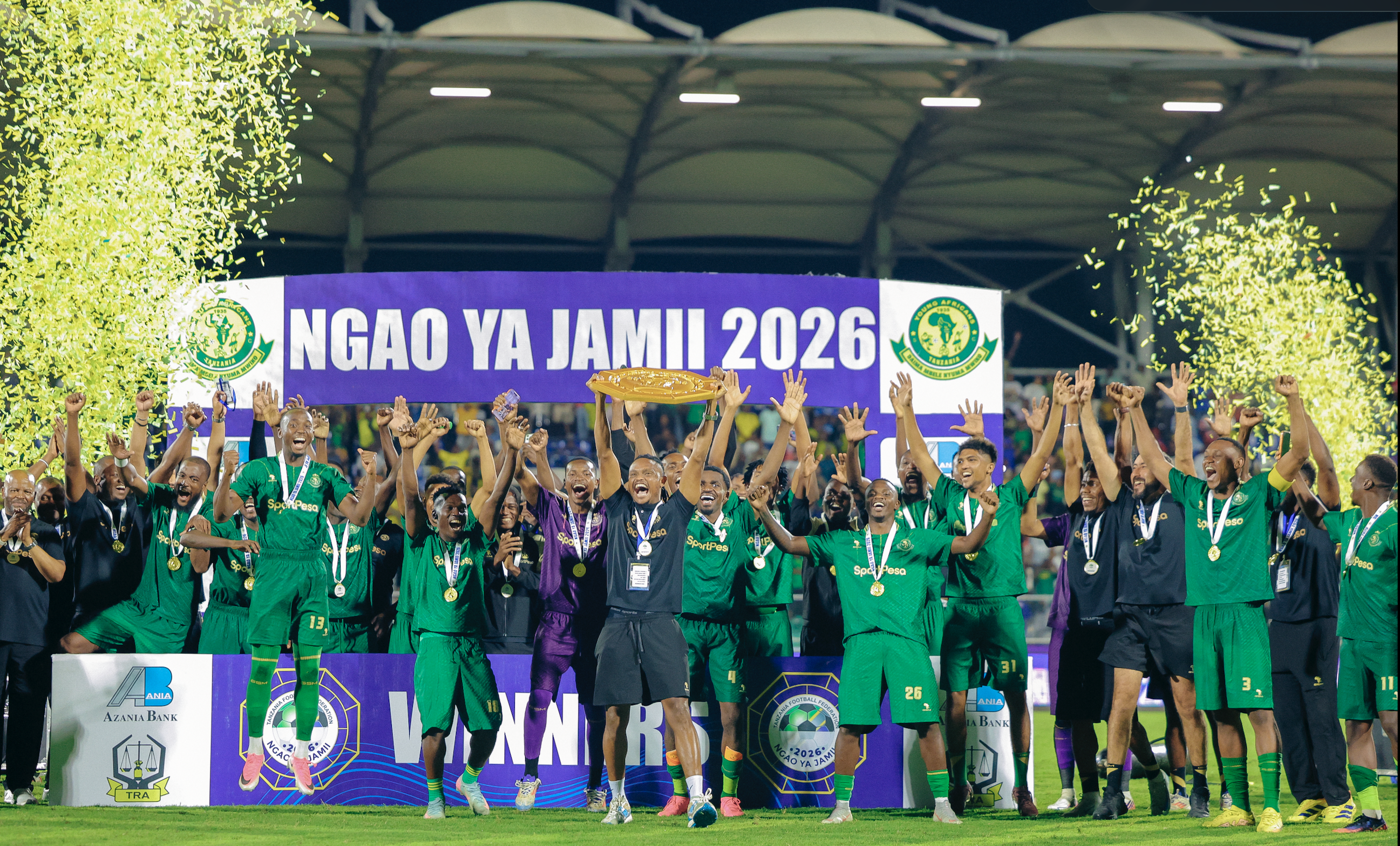 Yanga players celebrate with the Community Shield trophy.