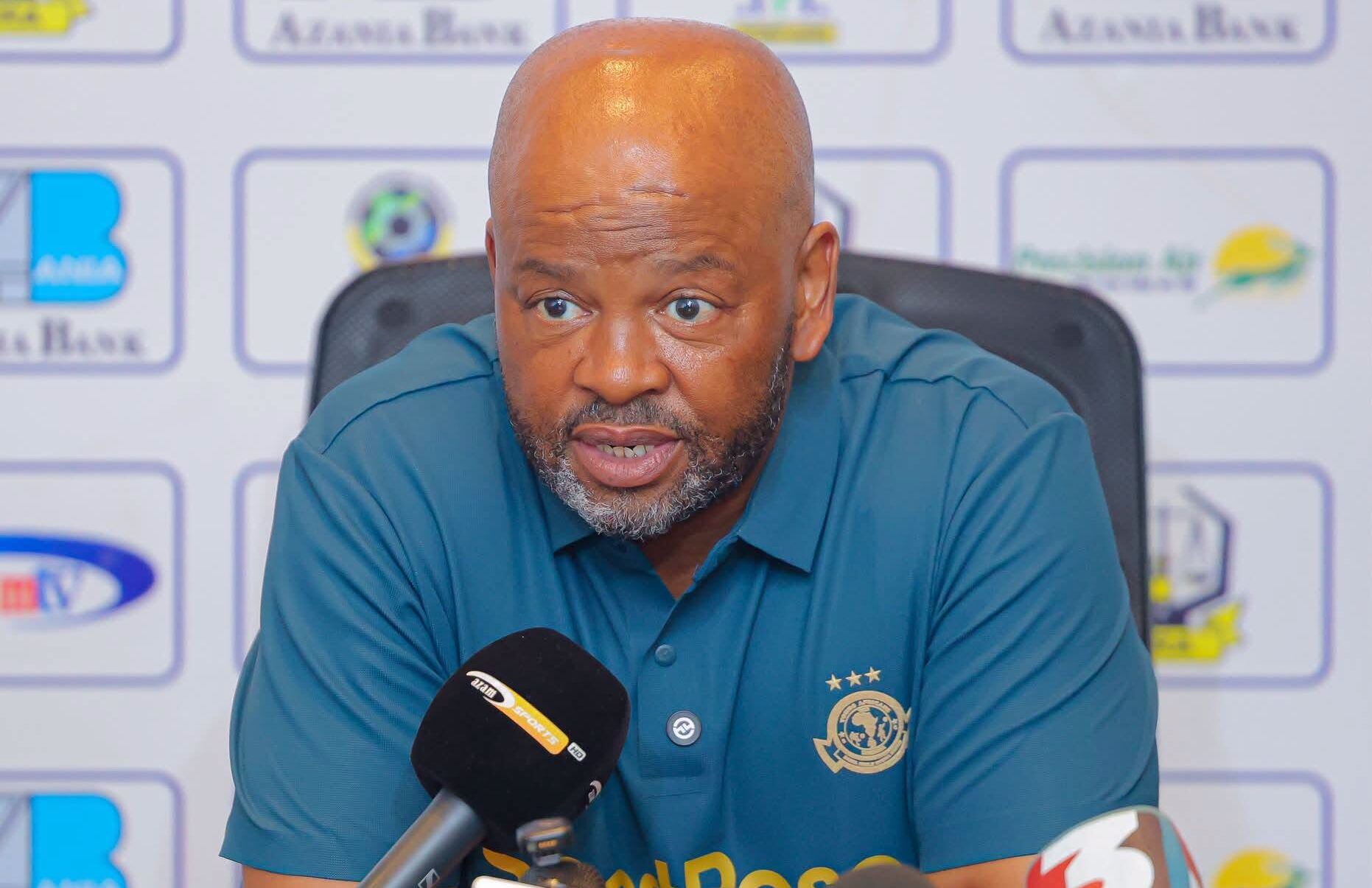 Young Africans coach Manqoba Mngqithi speaking