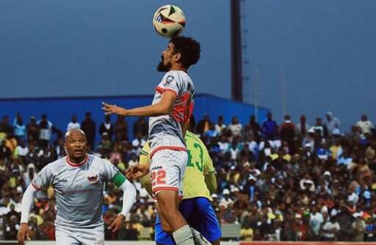 Chippa United defender Abbubaker Mobara in an aerial challenge with Kutlwano Letlhaku of Mamelodi Sundowns