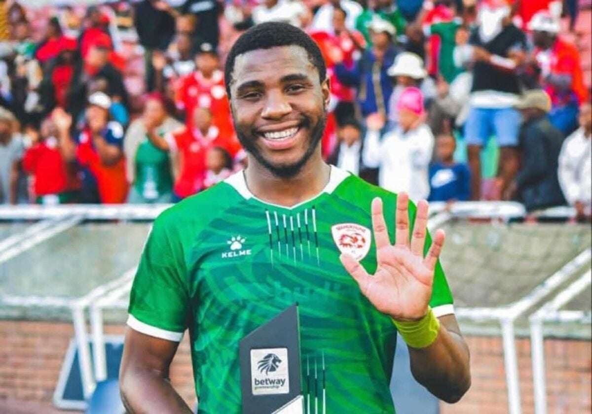 Bright Ndlovu holding a man of the match award at Sekhukhune United