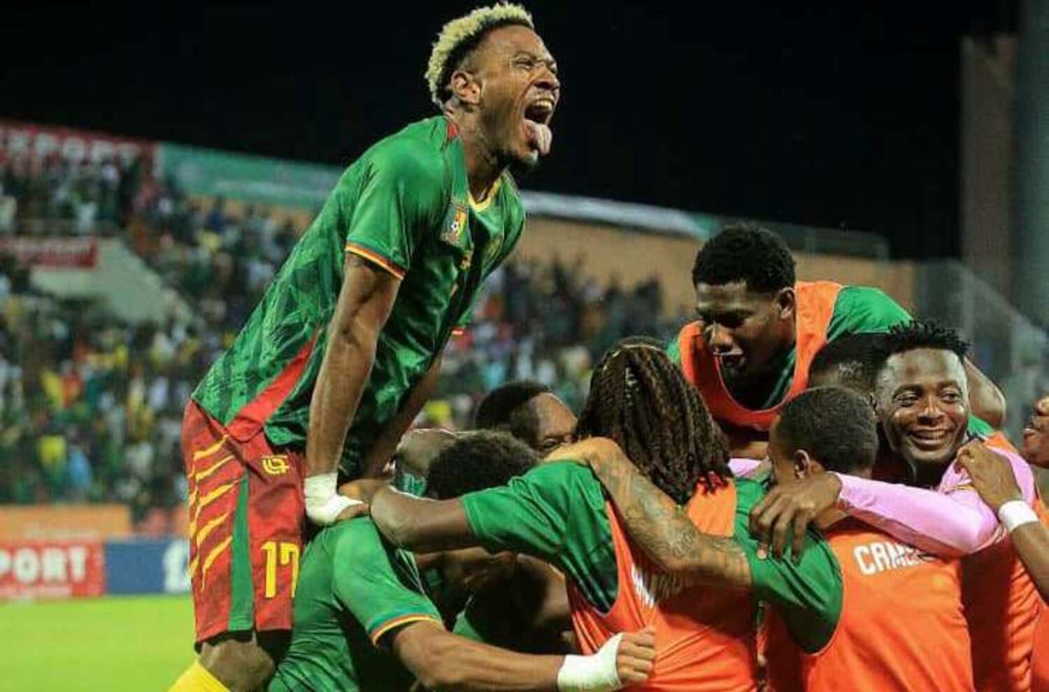 Emile Lako [R] celebrating with his Cameroon teammates