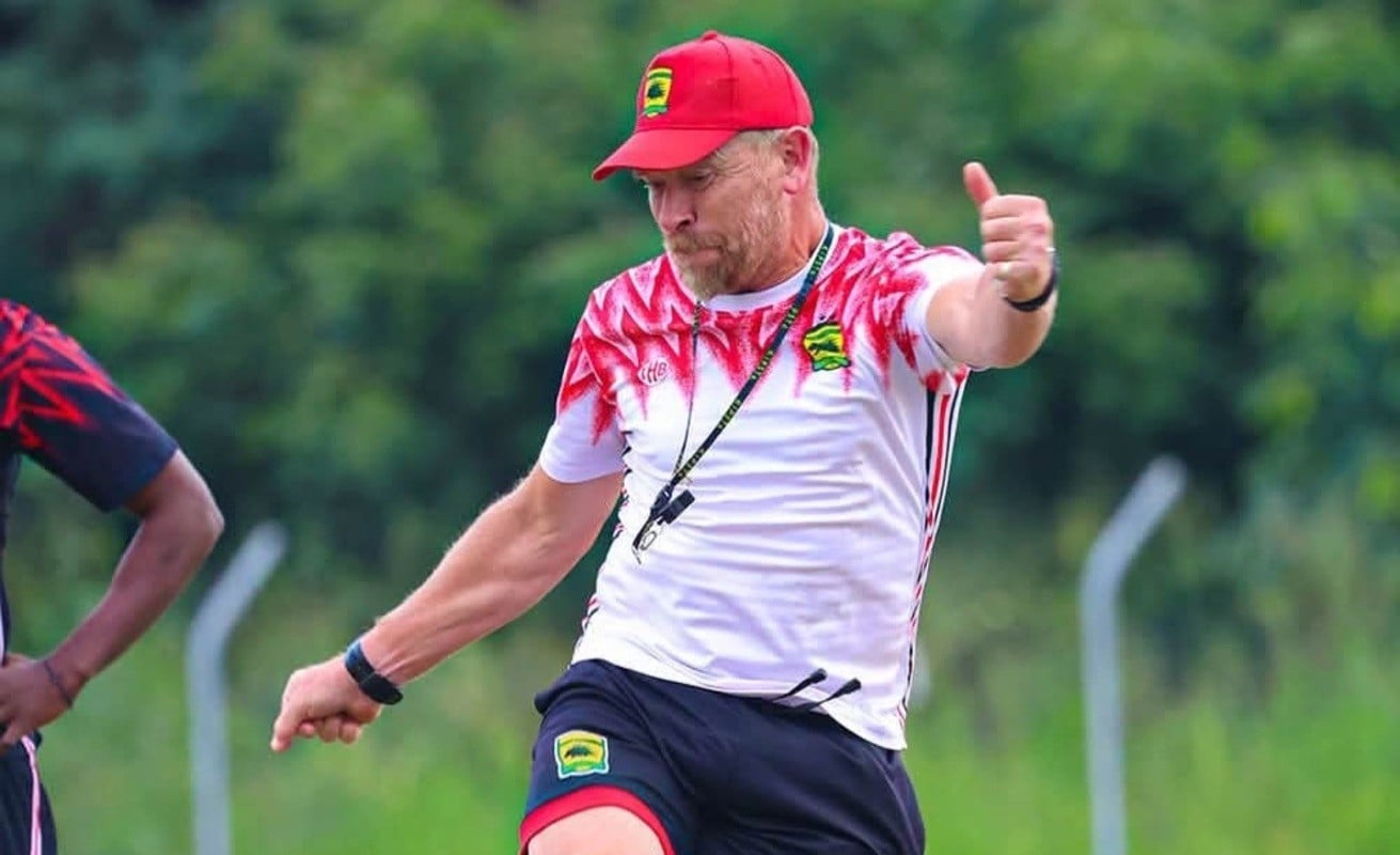 Eric Tinkler kicking a ball during a training session with Asante Kotoko SC.