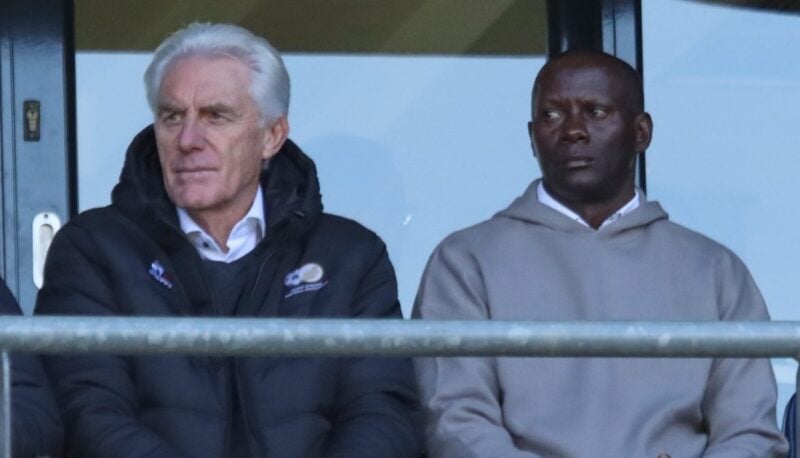 Hugo Broos with Helman Mkhalele in stands