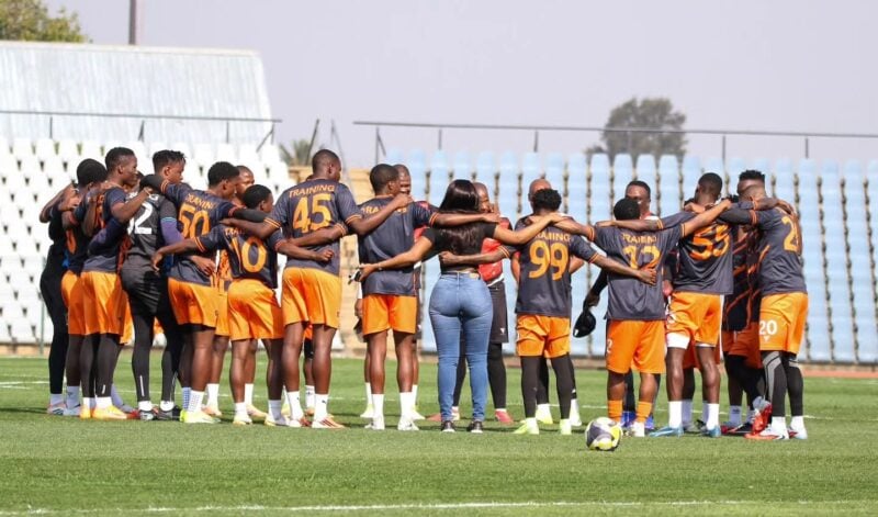 Lerumo Lions FC players having a team talk during a training session