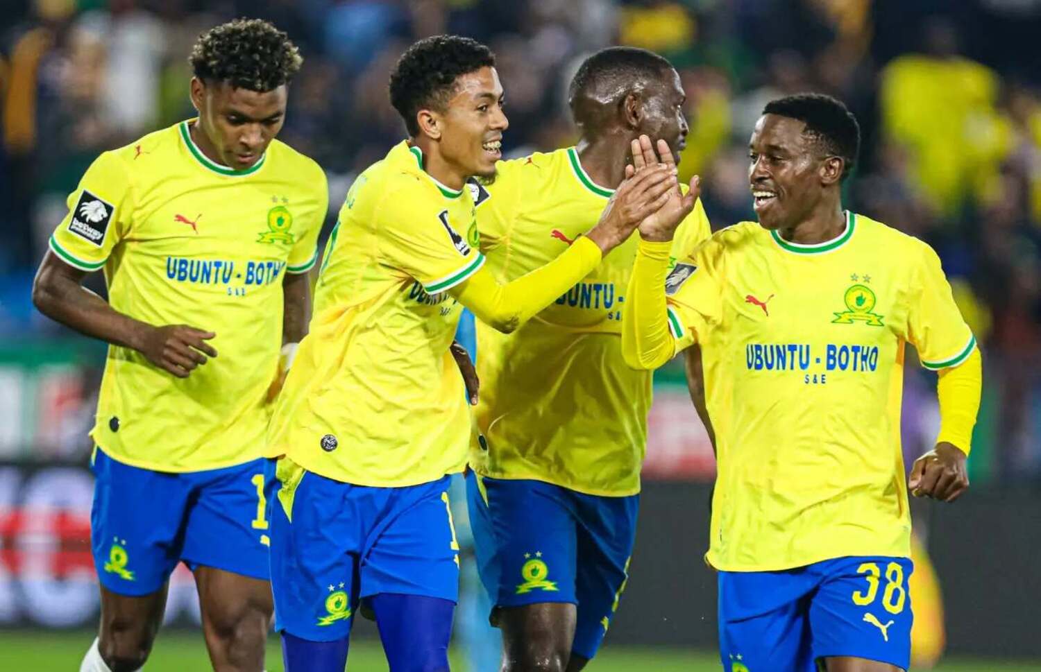 Mamelodi Sundowns players Brayan Leon, Tashreeq Matthews, Aubrey Modiba and Siyanda Ndlovu celebrate
