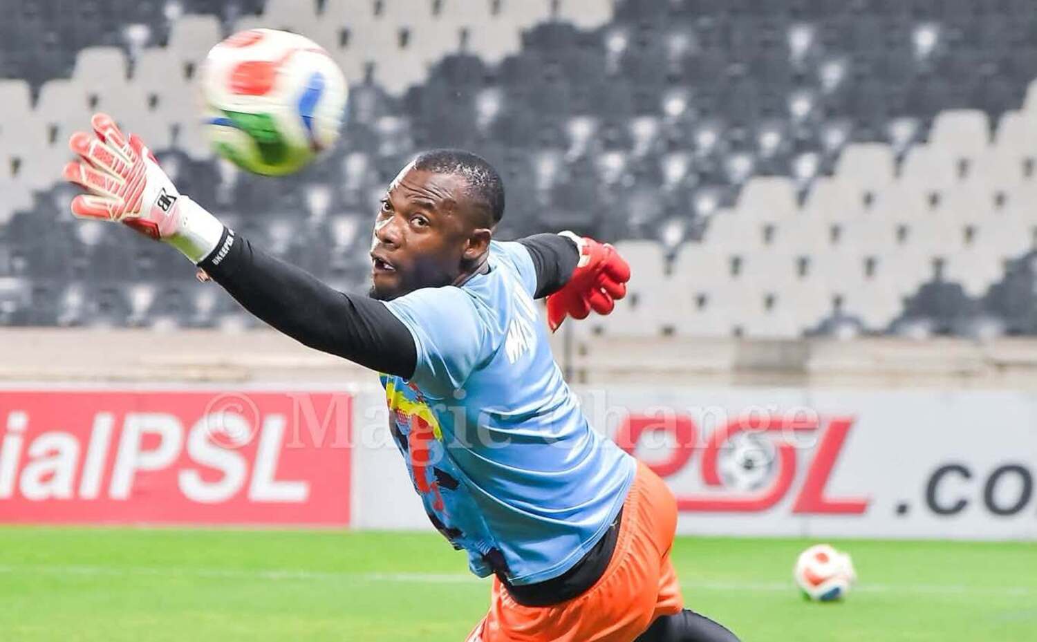 Kruger United Marcel Dandjinou diving to catch a ball