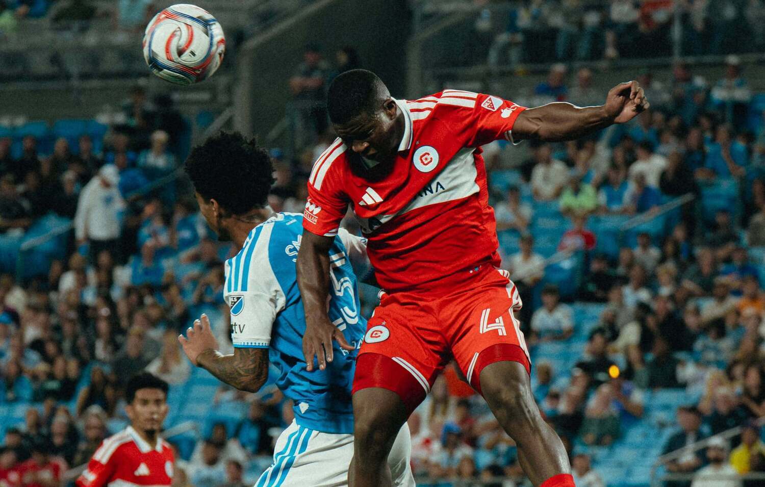 Chicago Fire FC defender Mbekezeli Mbokazi in an aerial challenge against an opponent