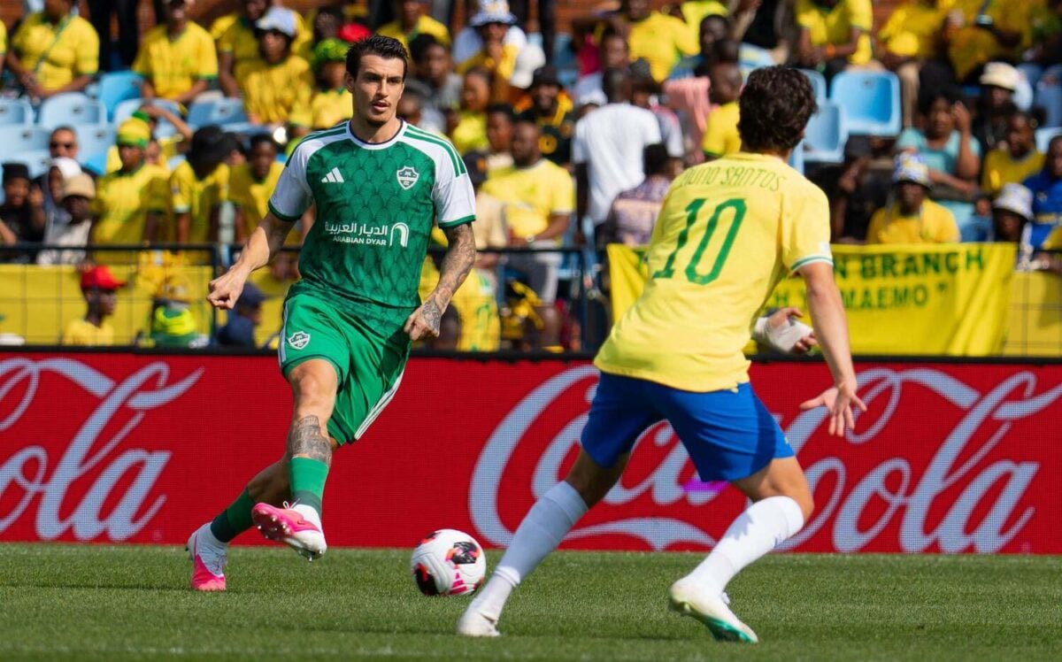 Mamelodi Sundowns midfielder Nuno Santos tries to block Al Ahli defender Roher Ibanez during a FIFA Intercontinental Cup match.jpg