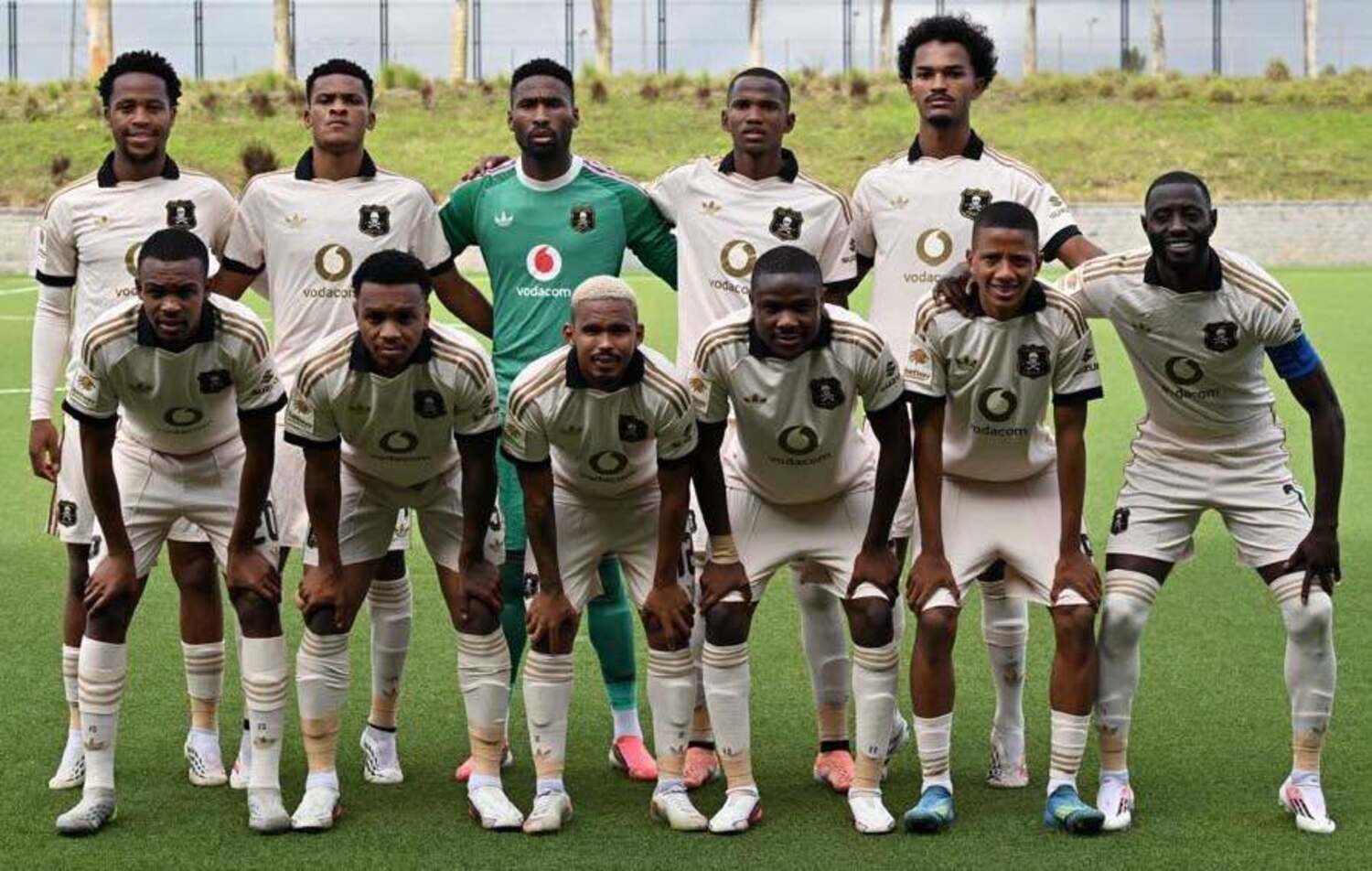Orlando Pirates players pose for a team photo before facing La Cure Waves
