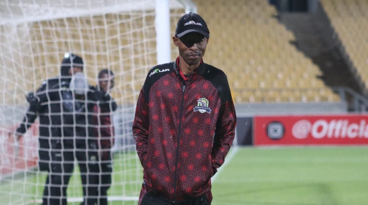 Phuti Mohafe doing a pitch inspection during a Marumo Gallants match.