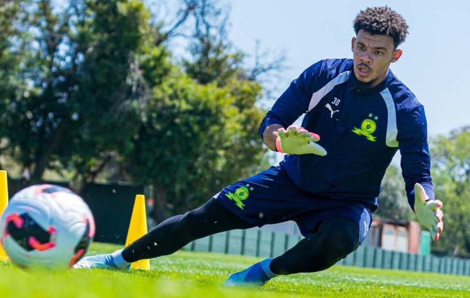 Ronwen Williams dives for the ball during a Mamelodi Sundowns training session