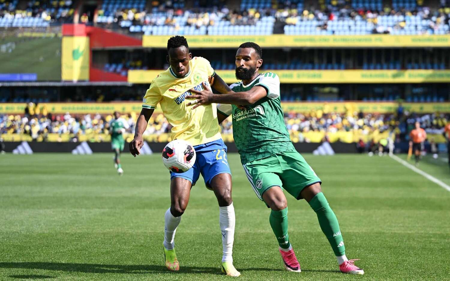 Mamelodi Sundowns defender Thabang Matuludi shruggs off the challenge of an Al Ahli player during a FIFA Intercontinental Cup match