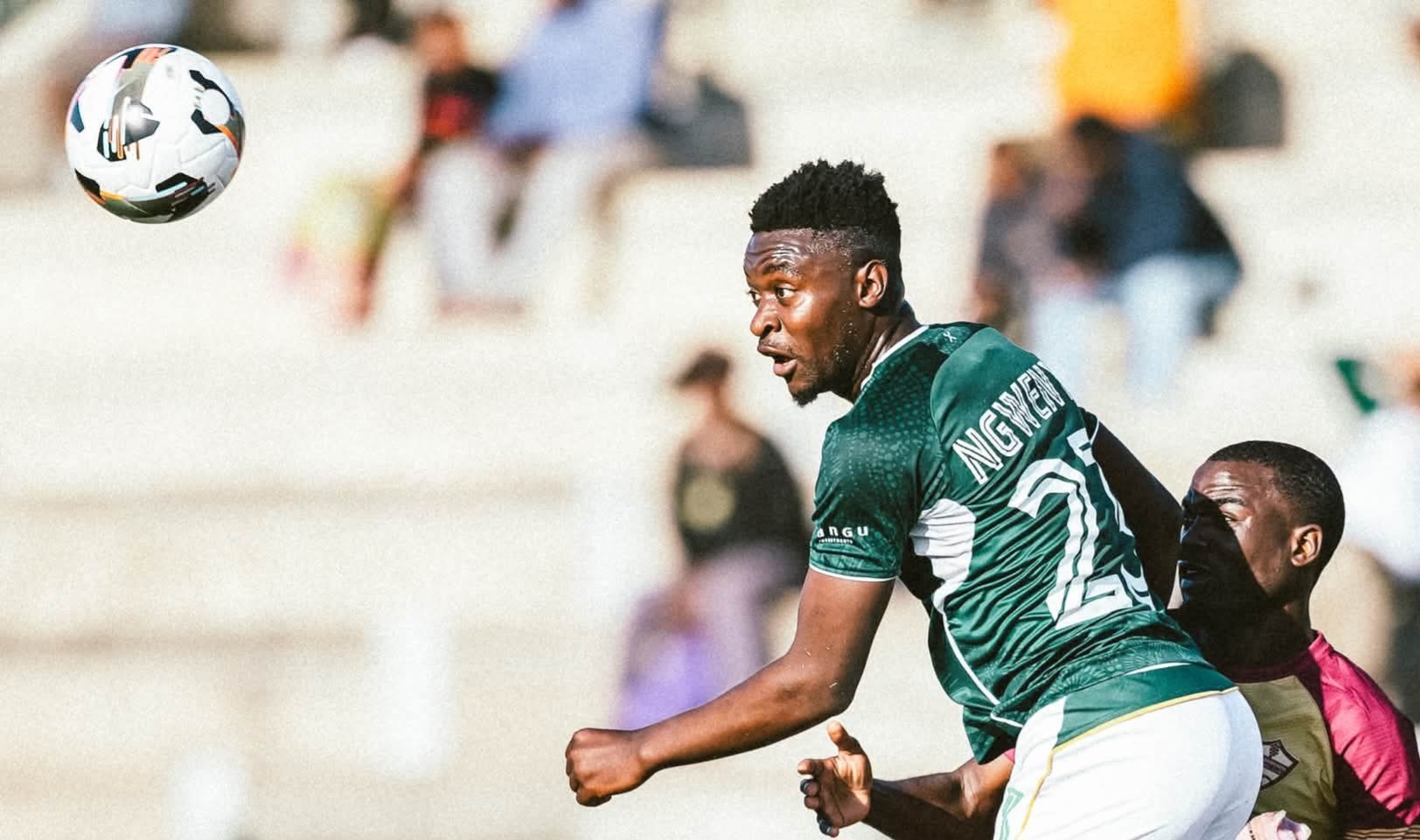 Thandolwenkosi Ngwenya heading a ball during a match for AmaZulu FC.