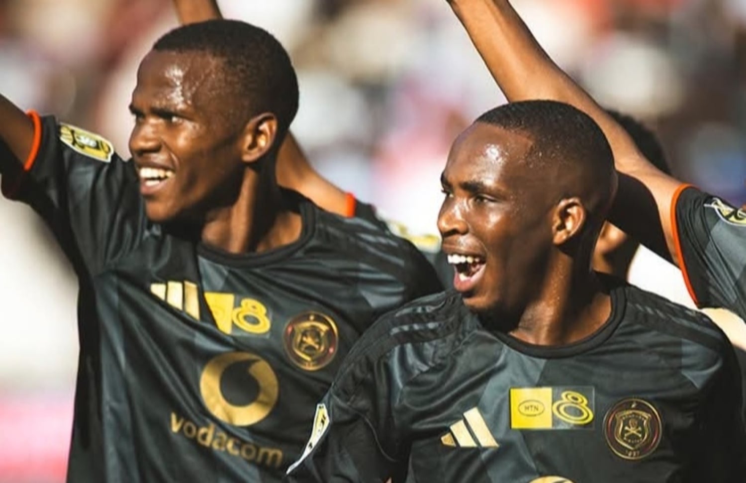 Thapelo Mokobodi in celebratory mood with his teammate after scoring for Orlando Pirates