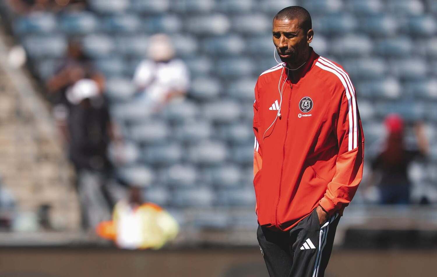Orlando Pirates coach Abdeslam Ouaddou walking on the pitch at Orlando Amstel Arena 