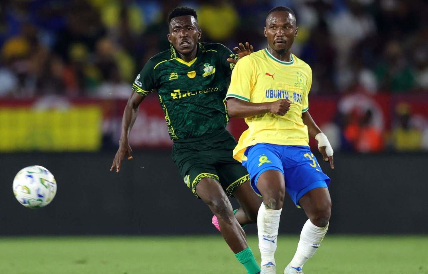 Mamelodi Sundowns striker Cassius Mailula being challenged by a Wiliete SC player