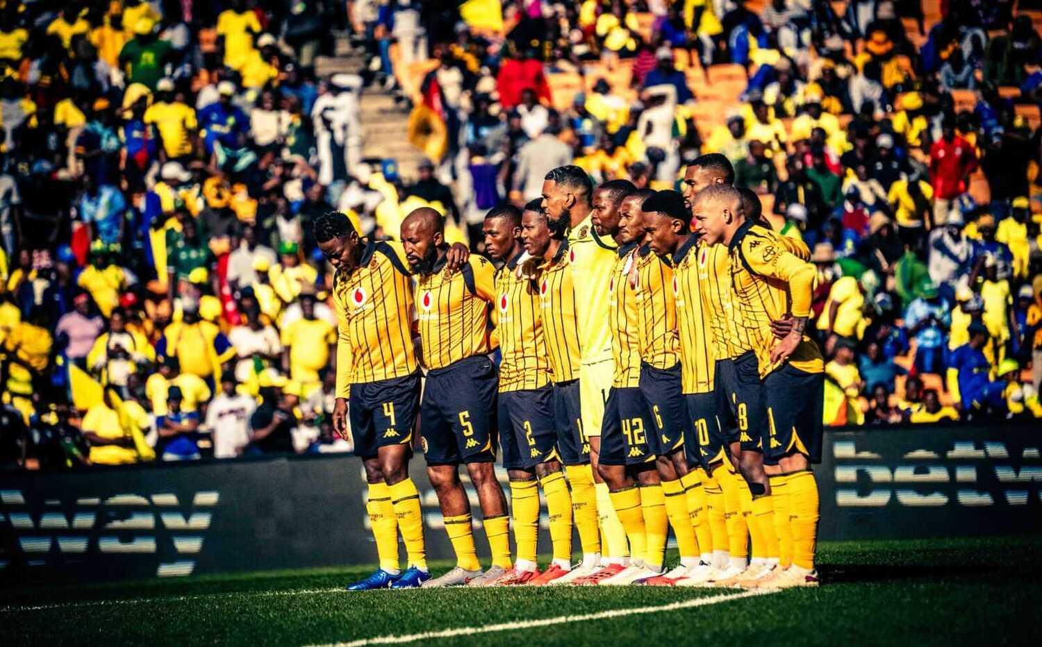 Kaizer Chiefs players observinf a minute of silence
