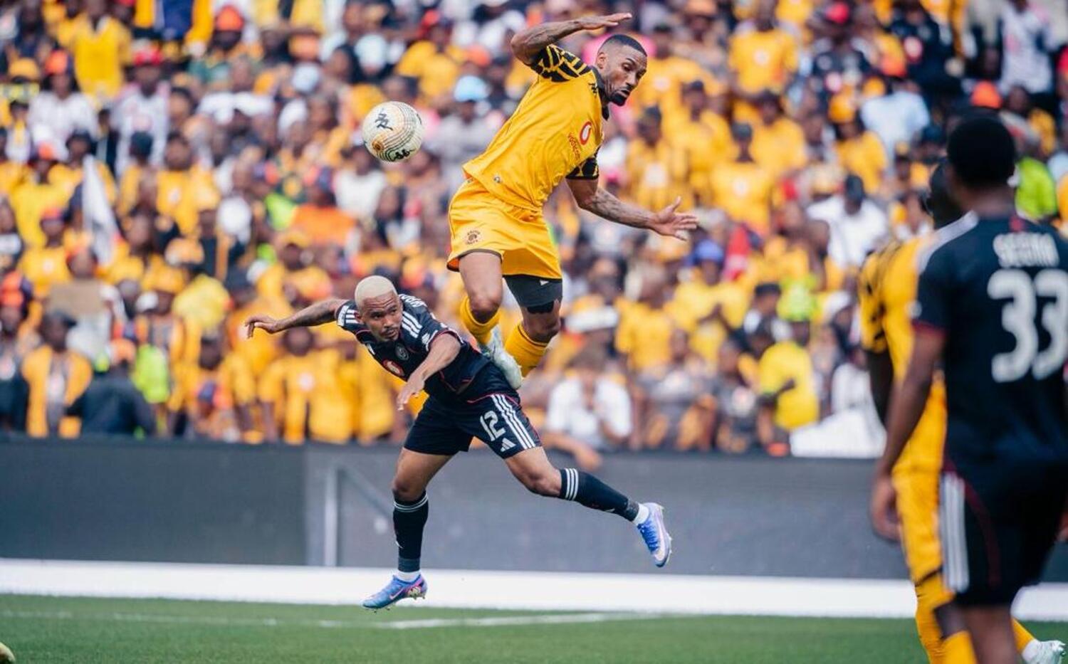 Kaizer Chiefs defender Inacio Miguel challenging for the ball against Orlando Pirates' Oswin Appollis during the Soweto Derby