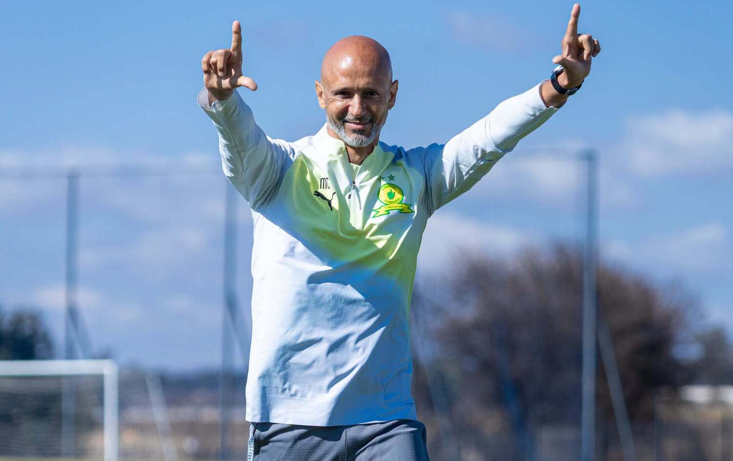Miguel Cardoso making the Mamelodi Sundowns hand gesture