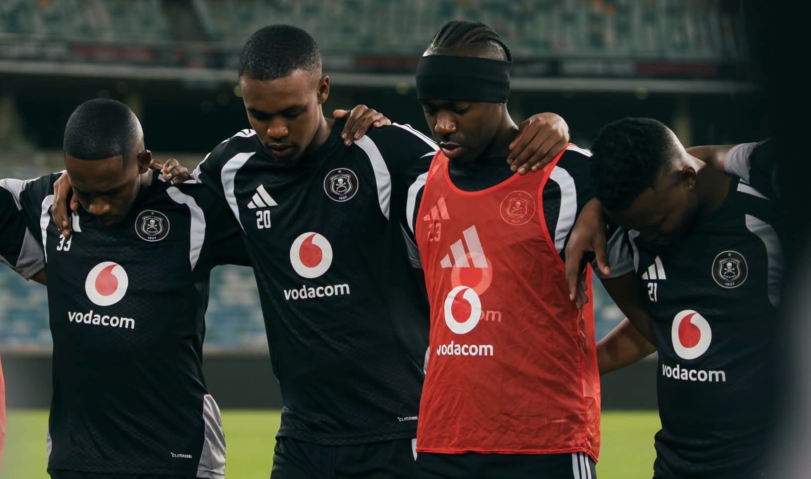 Orlando Pirates players having a prayer
