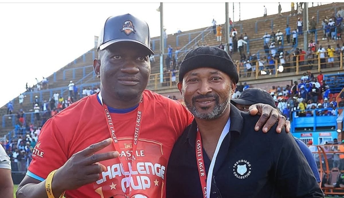 Peter Ndlovu with Scottland FC president Scott Sakupwanya.