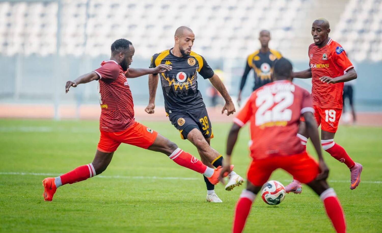 Kaizer Chiefs star Reeve Frosler passes the ball under the challenge of a Red Arrows player