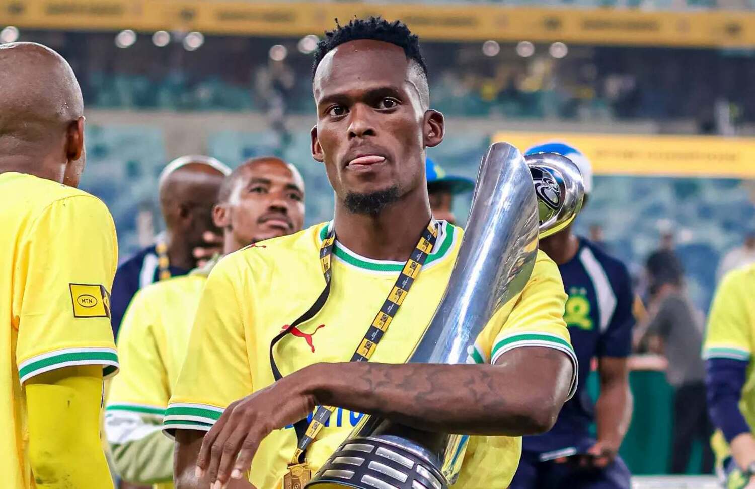 Thabang Matuludi with the MTN8 trophy won by Mamelodi Sundowns