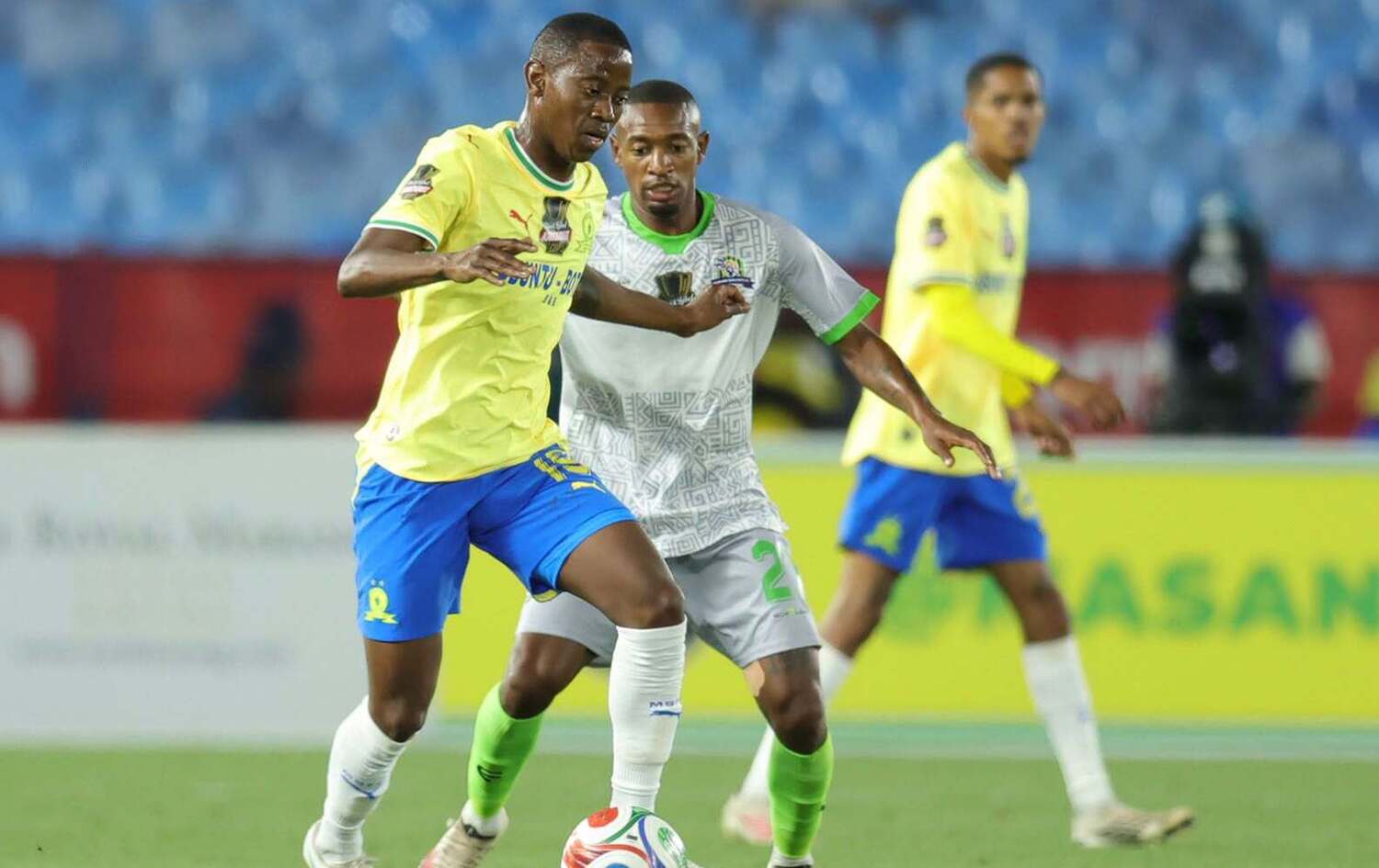 Mamelodi Sundowns midfielder Thabo Cele dribbles the ball past Marumo Gallants' Moremi Seketso