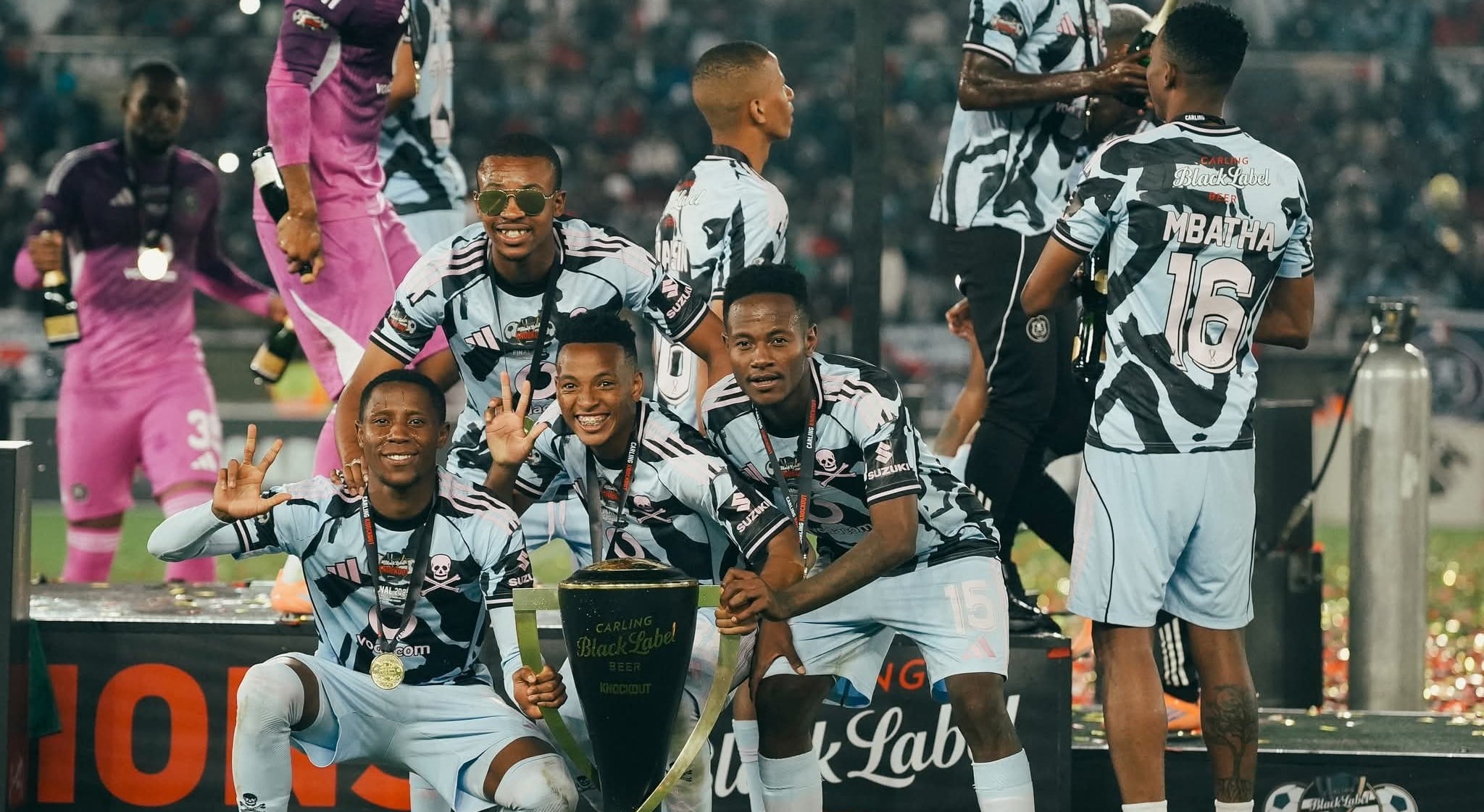 Orlando Pirates players celebrate winning the Carling Knockout Cup trophy after beating Marumo Gallants in Mbombela.